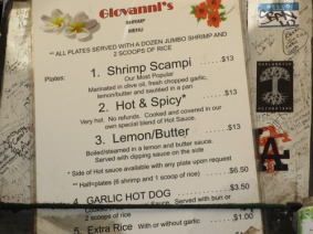 Menu from the Giovanni's Shrimp Truck - their plate lunches include 1. Shrimp Scampi (Most Popular) $13. 2. Hot & Spicy (Very Hot) $13. 3. Lemon/Butter $13. All plates are served with a dozen jumbo shrimp and 2 scoops of Rice